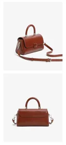 Leather handbag detail view showing brown genuine leather texture, top handle, and adjustable strap.