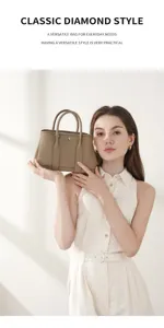 Classic leather garden handbag for women, versatile everyday tote bag with stylish design.
