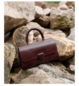 Luxury genuine leather women handbag, top handle crossbody bag with chic design and premium finish.