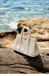 Detailed view of the premium leather tote bag highlighting fine texture and exquisite stitching.