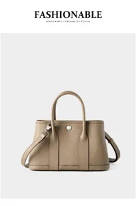 Genuine leather fashion tote bag with top handle and strap for women daily casual commute.