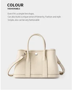 Detail view of premium genuine leather handbag featuring chic metal closure and structured design.