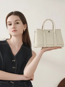 Premium leather garden tote bag for women, stylish vintage top handle handbag with elegant design.