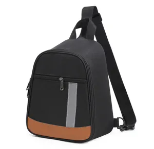 Black single-strap lunch bag detail, waterproof material with front pocket and reflective stripe.
