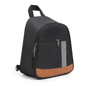 Insulated lunch backpack with black fabric and brown leather bottom, featuring front zipper pocket.