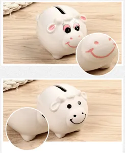 Close-up detail of creative ceramic piggy bank, smooth white porcelain surface with cute paint.