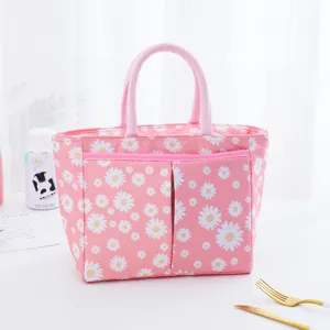 Pink daisy print insulated lunch bag with handles and front pocket for daily work or picnic use.