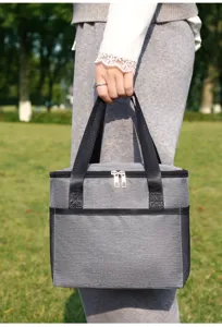 Portable grey insulated lunch bag for outdoor picnic, camping, and daily meals use easily.