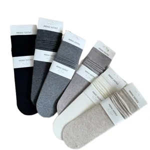 Solid color minimalist cotton slouch socks for women, soft daily casual long hosiery set.