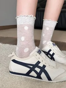 White polka dot sheer mesh mid-calf socks with ruffle trim, breathable summer sock detail.