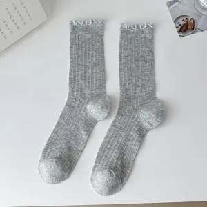 Grey ribbed women socks with lace ruffle trim, stylish ballet core mid-tube casual hosiery.
