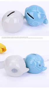 Detailed view of cute ceramic elephant piggy bank, perfect desktop decor and sweet gift choice.