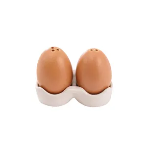 Ensemble de salières et poivrières en céramique en forme d'œuf pour table de cuisine.