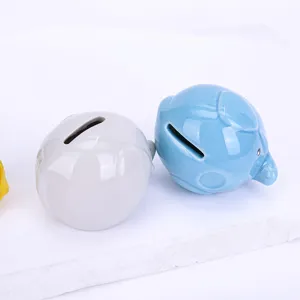 Cute ceramic elephant piggy bank desktop ornament and money box in blue and gray colors.