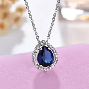 Close-up detail of the elegant pear-shaped blue zirconia pendant necklace with fine chain.