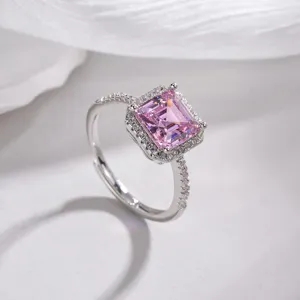 Gorgeous princess cut pink zircon ring with dazzling halo stones and adjustable silver band.
