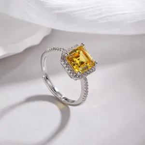 Stunning radiant cut yellow zirconia halo ring in silver finish with adjustable open band.