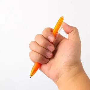 Closeup of orange erasable gel pen showing smooth writing tip and convenient clicker top.