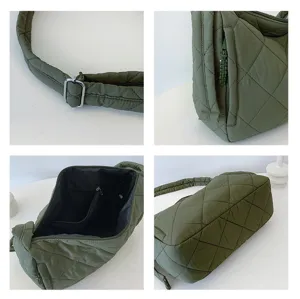 Detailed view of quilted puffer shoulder bag showing adjustable strap, zipper pocket and lining.
