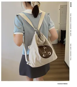 Sac à dos et sac à bandoulière en toile pour femme, fourre-tout élégant et décontracté.