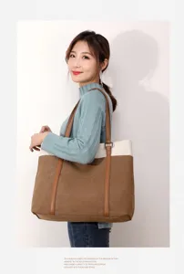Detail view of stylish women canvas shoulder bag in brown and white color, perfect for casual wear.