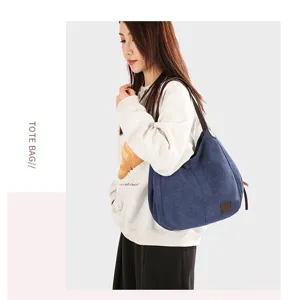 Detail shot of the stylish casual canvas tote shoulder bag worn by model, showing daily use.