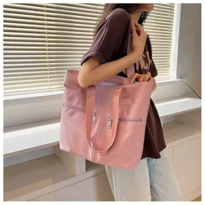 Pink nylon tote bag for women, large capacity casual shoulder bag with multiple zipper pockets.
