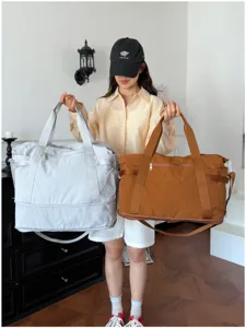 Large capacity travel duffel bag for women and men, lightweight gym bag with shoe compartment.