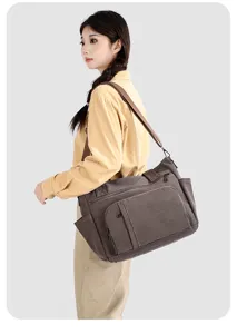 Vintage canvas shoulder bag detail view, multi-pocket travel messenger bag for daily use.