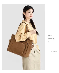 Vintage canvas tote bag with multiple pockets, casual crossbody shoulder bag for travel.
