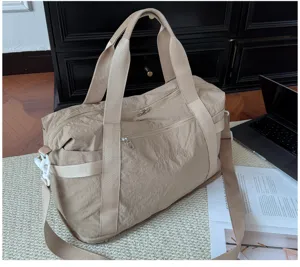 Minimalist travel duffel bag for men and women, lightweight gym and short trip luggage bag.