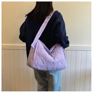 Casual quilted shoulder bag for women, large capacity cotton padded crossbody bag in light purple.