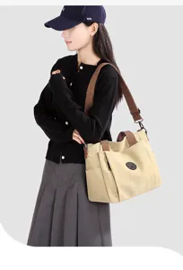 Leinwand-Tasche für Damen, große Umhängetasche mit braunen Trägern, lässiger Pendler-Stil.