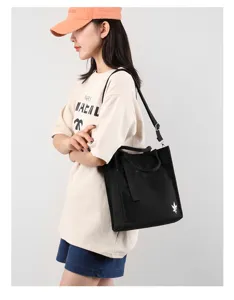 Canvas shoulder bag detail shot, daily casual black tote bag with strap and top handles for women