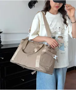 Large capacity travel duffel bag for women, lightweight overnight weekender bag with shoe compartment.