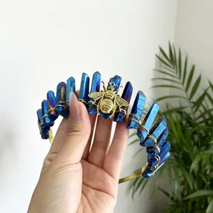 Close-up detail shot of blue quartz crystal tiara crown headband with gold bee accent.