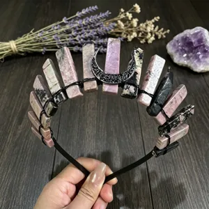 Close-up detail shot of handmade natural crystal crown headband with black moon design for girls