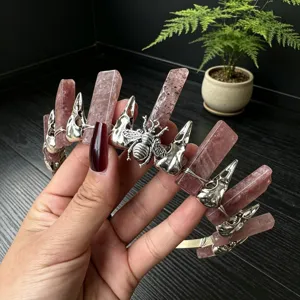 Gothic crystal crown headband detail, raw pink quartz pillars with silver skull and bee.