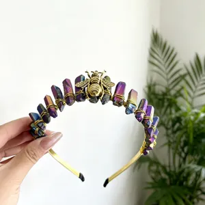 Crystal crown headband detail featuring colorful quartz stones and a gold bee centerpiece.