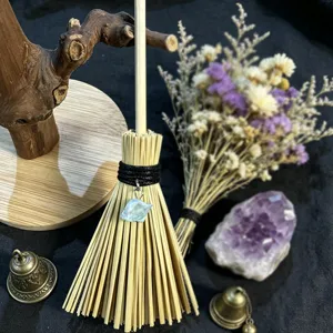 Detail view of the Wicca mini broom hanging ornament with crystal stone for car decor.