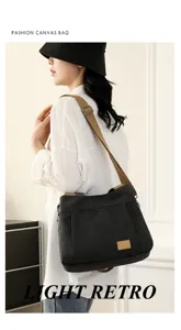 Stylish black canvas shoulder bag for women, large capacity minimalist crossbody bag.