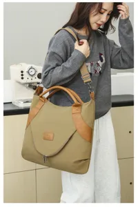 Retro nylon shoulder bag detail, large capacity tote bag with leather trim and handy zipper pocket.