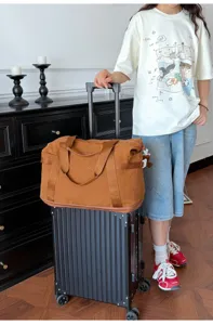 Travel duffel bag for men and women, lightweight waterproof luggage bag for short trips and gym use.