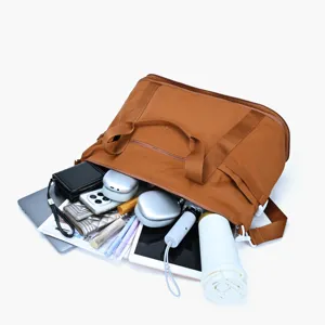 Casual travel duffel bag with large capacity, durable brown fabric, perfect for short trips.