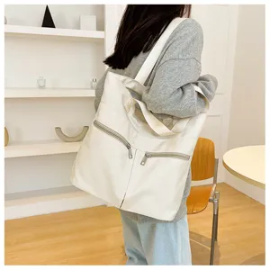 Trendy minimalist nylon tote bag for women, large capacity shoulder bag with zipper pockets.