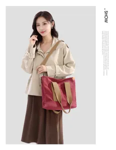 Minimalist casual large canvas tote bag for women, stylish shoulder bag with comfortable straps.
