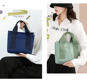 Casual canvas tote bag for women, versatile daily handbag with front pocket, stylish and durable.