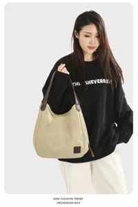 Casual canvas shoulder bag for women, retro tote bag with leather handles and spacious interior.