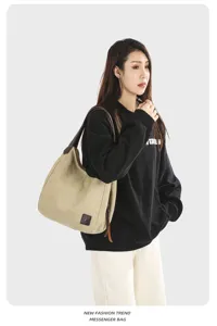 Casual canvas shoulder bag for women, stylish minimalist hobo bag with leather straps.