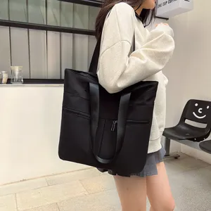 Stylish black nylon tote bag for women, large capacity shoulder bag for daily casual wear.